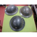 Three WWII British Steel helmets, one marked with an 'R' with liners.