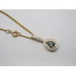 An 18ct Gold Brazilian Alexandrite and Diamond Set Pendant, of pear shape, on elongated bale, on