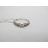 An 18ct White Gold Diamond Single Stone Ring, the brilliant cut stone four claw set between