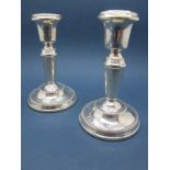 A Pair of Hallmarked Silver Candlesticks, Birmingham 1977, 11cm high (bases weighted). (2)