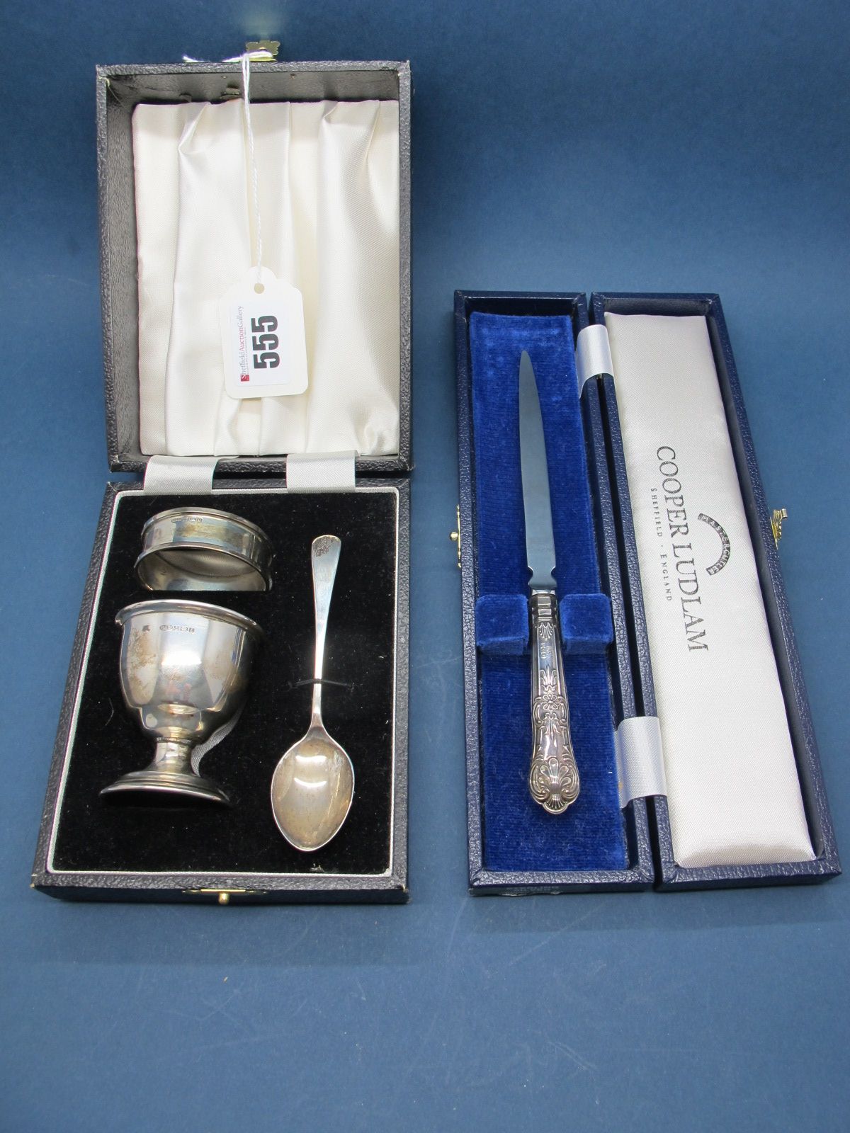 A Hallmarked Silver Christening Set, comprising egg cup, spoon and napkin ring, in original fitted