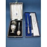 A Hallmarked Silver Christening Set, comprising egg cup, spoon and napkin ring, in original fitted