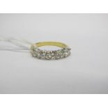 An 18ct Gold Five Stone Diamond Half Eternity Style Ring, claw set throughout with uniform brilliant