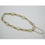 A Modern 9ct Gold Opal Set Bracelet, composed of six oval cabochon opals, collet set between