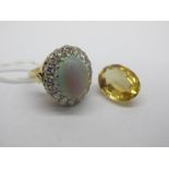 A Large 18ct Gold Opal and Diamond Cluster Ring, the (15x12mm) oval cabochon opal claw set, within