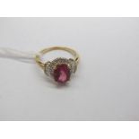A 9ct Gold Cruzeiro Rubellite and Diamond Set Ring, oval four claw set to the centre, within