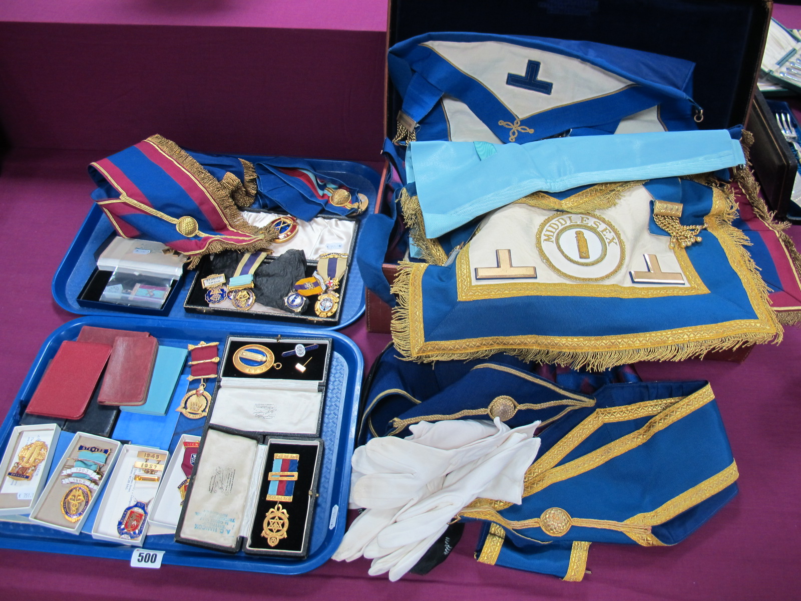 A Collection of Masonic Regalia, including medallion badges, jewels, aprons, sashes, gloves,