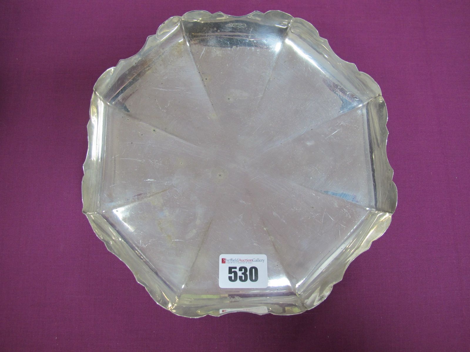 A Hallmarked Silver Dish, EV, Sheffield 1940, of octagonal form with wavy cut edge, raised on four