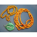 A Four Row Amber Coloured Bead Necklace; together with a graduated bead necklace (damaged) and a