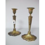 A Pair of Hallmarked Silver Candlesticks, Walker & Hall, Sheffield 1914, each with tapering stem,