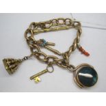 A Curb Link Bracelet, to ring clasp, suspending hardstone inset circular swivel fob pendant,