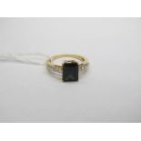 An 18ct Gold Single Stone Lajao Tourmaline Ring, rectangular four claw set, between brilliant cut