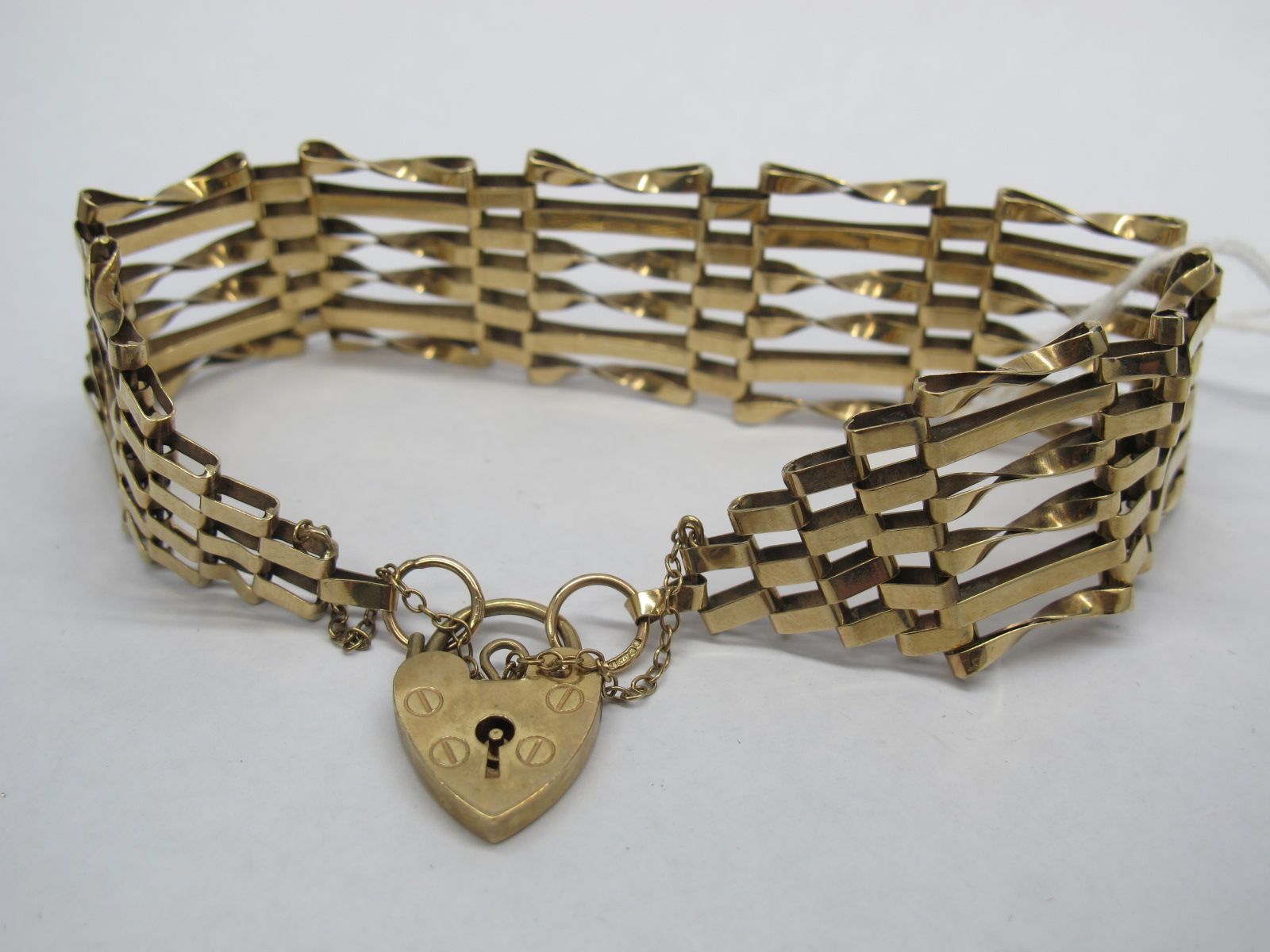A 9ct Gold Gate Link Style Bracelet, to 9ct gold heart shape padlock clasp.