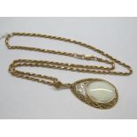 A Large Modern 9ct Gold Opal Set Pendant, oval collet set to the centre, within openwork scroll