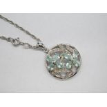 A Blue Tourmaline and Diamond Set Openwork Pendant, of circular design claw set, stamped "750", on