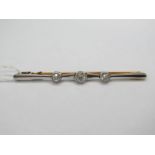 A Three Stone Diamond Set Bar Brooch; collet rubover set with old cut stones on shaped bar.