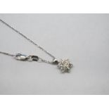 An 18ct White Gold Diamond Set Pendant, of flowerhead cluster design, on 18ct white gold chain.