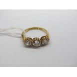 An 18ct Gold Three Stone Diamond Ring, the graduated old cut stones multi claw set, Birmingham 1906.
