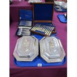 A Set of Twelve Decorative Plated Knives and Forks, in fitted wooden case with lift out tray;