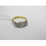 A Large Three Stone Diamond Ring, the central (5.5mm) old brilliant cut stone eight claw set,