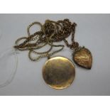 A Large Plain Circular Locket Pendant, stamped "9ct Front Back", on a 9ct gold chain; together