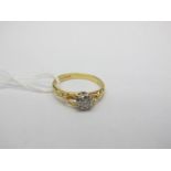 An 18ct Gold Single Stone Diamond Ring, illusion set between openwork shoulders.