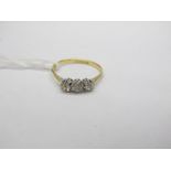 A Three Stone Diamond Ring, the old cut stones claw set, stamped "18ct&Pt".