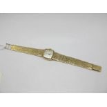 Rone; A 9ct Gold Cased Ladies Wristwatch, the signed cushion shape dial with baton markers, to