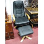 A Stressless Style Black Armchair; together with a foot stool. (2)