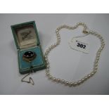 A Single Strand Pearl Bead Necklace, of uniform design, to ball clasp; together with an oval brooch,