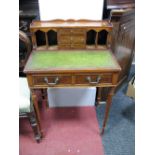 A Yew Wood Bonheur du Jour, with a three-quarter gallery, pigeon holes, three central drawers, green