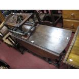 A XIX Century Oak Gate Leg Table, oval top, on ring turned and baluster stretcher legs, length fully