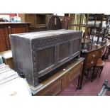 A XVII Century Oak Blanket Box, frieze with knulled decoration, three panelled base stile feet (in