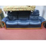 A Stressless Three Seater Reclining Sofa, fitted with individually reclining seats, shaped arms,
