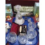 A Cut Glass Decanter with Label, four cut glass dessert dishes, silver plated cruet set, leather