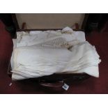 Linen, including bedspread, crocheted tablecloths, etc in a leather suitcase.