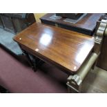 A XIX Century Mahogany Tea Table, with a fold over top on turned legs.