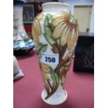 A Moorcroft Vase, of slender ovoid form, decorated with flowers and foliage on a cream ground, for