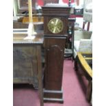 An Oak Grandmother Clock, with a caddy top, brass dial, shaped door, on a plinth base.