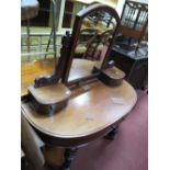 A Mid XIX Century Mahogany Duchess Dressing Table, the central mirror with shaped supports, two