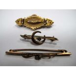 An Opal Set Bar Brooch, circular collet set; a 9ct gold brooch and another brooch. (3)