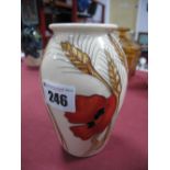 A Moorcroft Pottery Vase in the 'Harvest Poppy Pattern by Emma Bossons, shape 393/5, impressed and