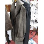 A Fox Fur Short Cape, a fur cape and a full length faux fur coat.