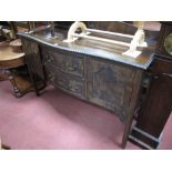 A 1920's Mahogany Sideboard, with low back, gadrooned border, twin drawers and cupboard doors to