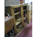 An Ercol Elm Display Cabinet, twin bevelled glazed doors, with adjustable shelving.