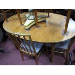 A McIntosh Teak Dining Table, oval draw leaf top with concealed fold out leaf and six matching