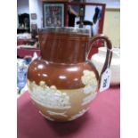 A XIX Century Doulton Lambeth Stoneware Jug, featuring hunting scenes and topers with reeded