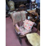 A XX Century Mahogany Rocking Chair, top rail with marquetry inlay, scroll shaped arms, turned