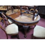 An Early XX Century Mahogany Oval Topped Wind-Out Dining Table, with gadrooned edge, on carved