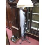 A XX Century Cast Iron Standard Lamp, with a brass and copper well, telescopic action, with